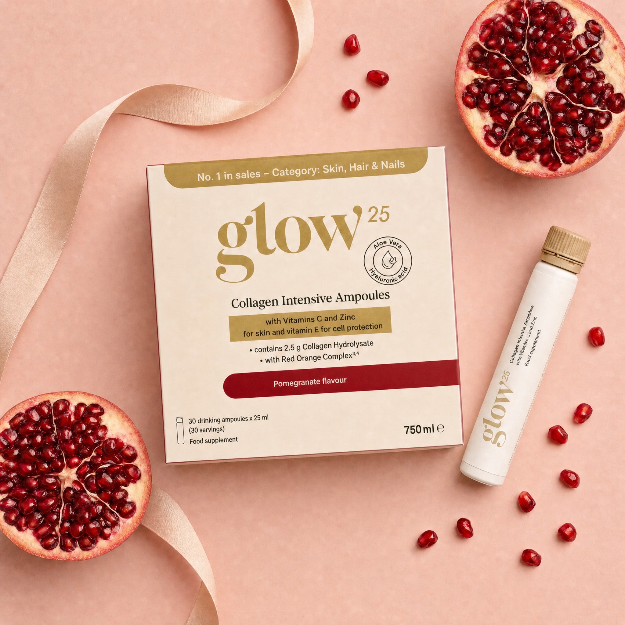 Collagène Intensif Ampoules mit Ampulle und Granatapfel, angerichtet auf dem Tisch